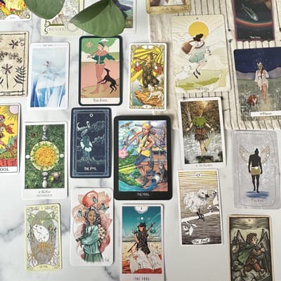 the fool tarot card in various decks laid out